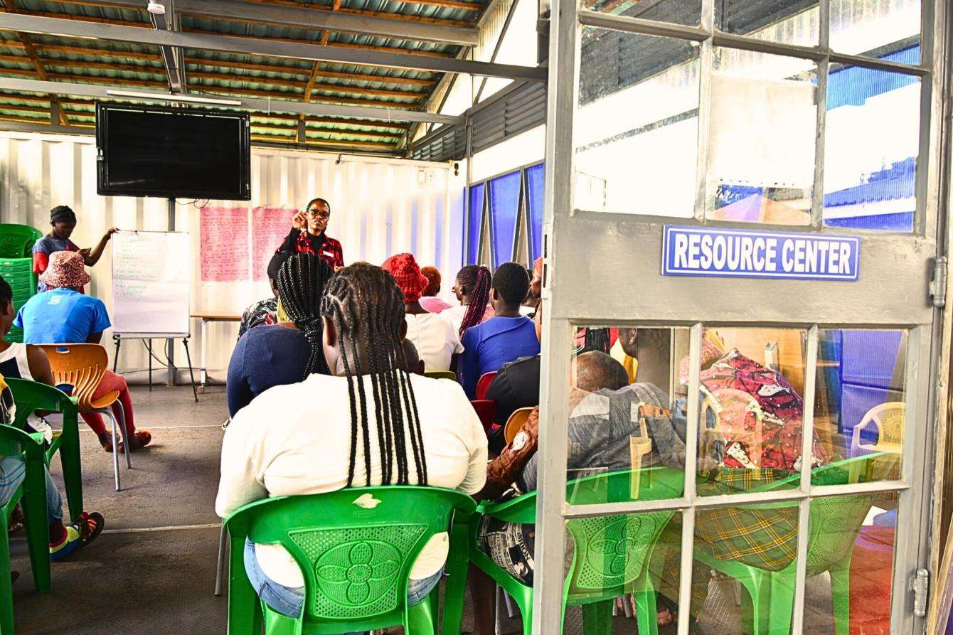 Youth attend an education session at a community center in Nairobi, Kenya.