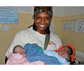 Dr. Africa Stewart holding newborn babies