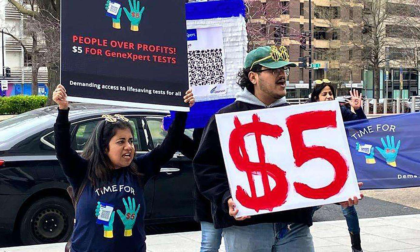 Protesters holding signs in Washington, DC as part of the Time for $5 campaign.