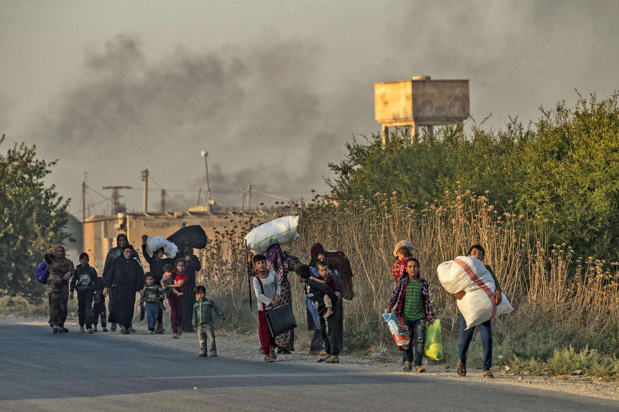Civilians fleeing offensive in Ras al-Ain, Syria