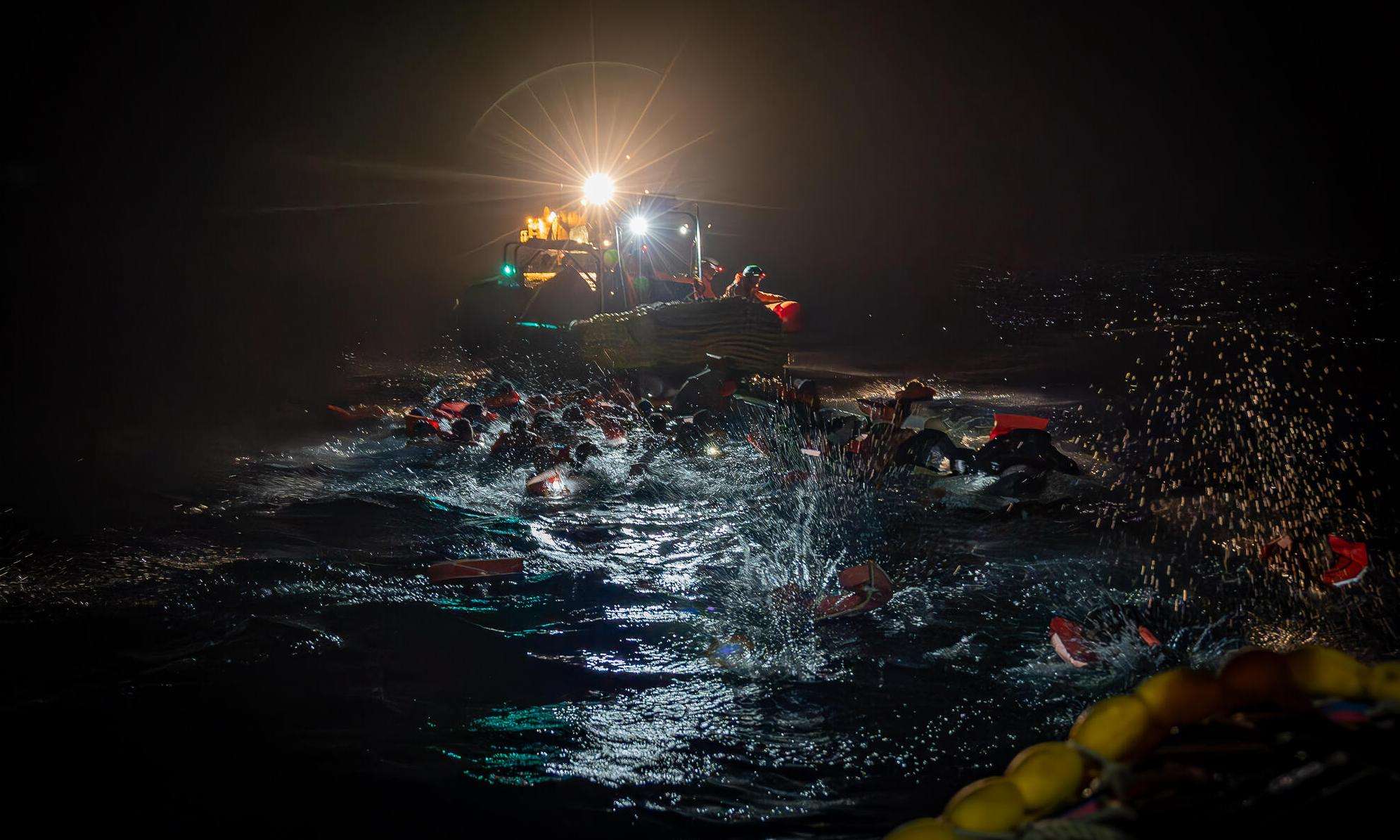 MSF search and rescue team rescues people from a boat in distress in the Central Mediterranean.