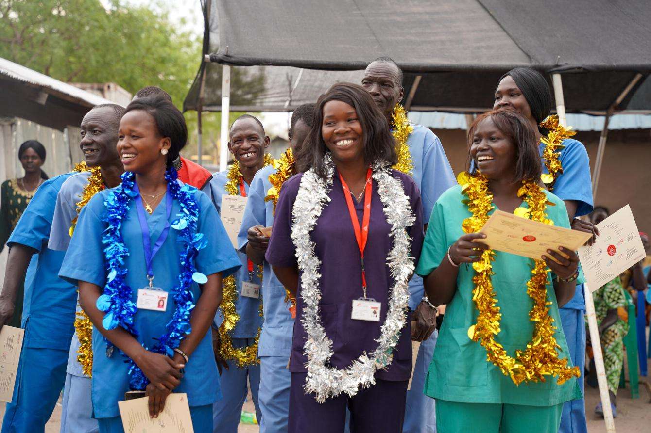 Women celebrate graduating from the MSF Academy for Healthcare in Lankien, South Sudan.