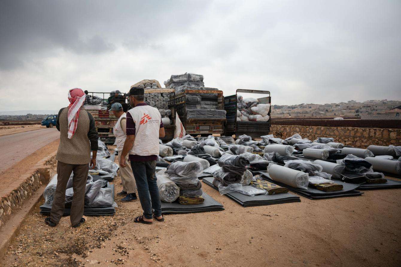 MSF teams offload winter supplies donated by MSF to camps in northwest Syria.