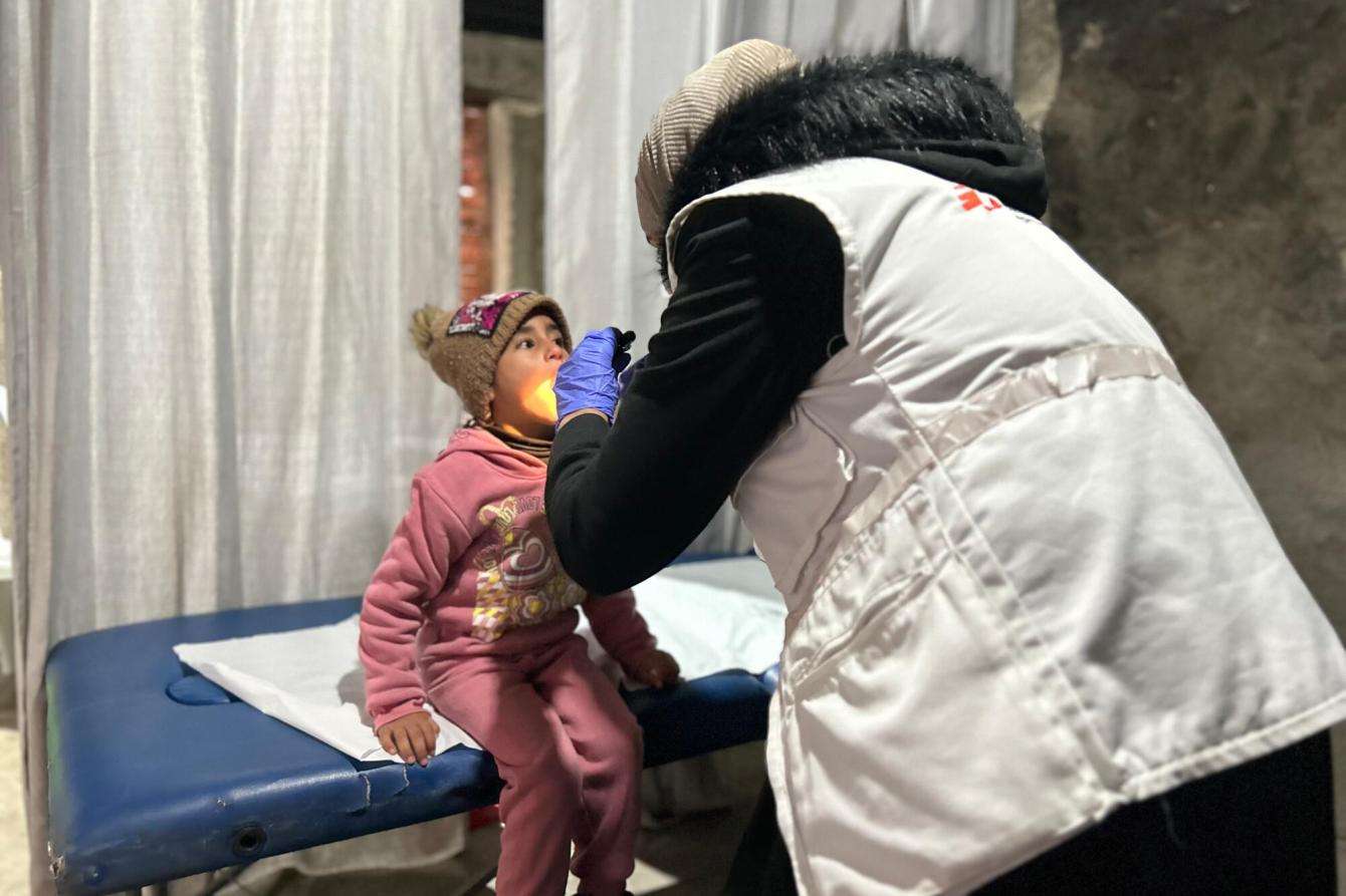 An MSF staff member treats a Palestinian child patient in Hebron, occupied West Bank.