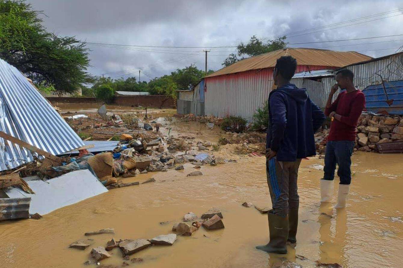 A worker surveys flood damage in Baidoa, Somalia. 