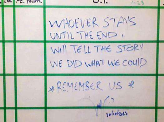 A whiteboard at Al-Awda Hospital in Gaza with a message from an MSF doctor: Remember us