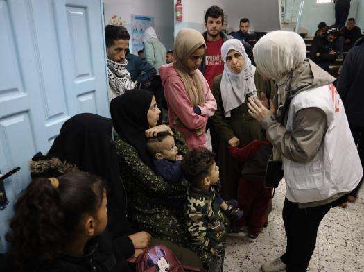 MSF staff talk to patients at Al-Shaboura clinic in Rafah in the south of Gaza.