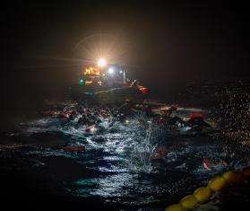 MSF search and rescue team rescues people from a boat in distress in the Central Mediterranean.