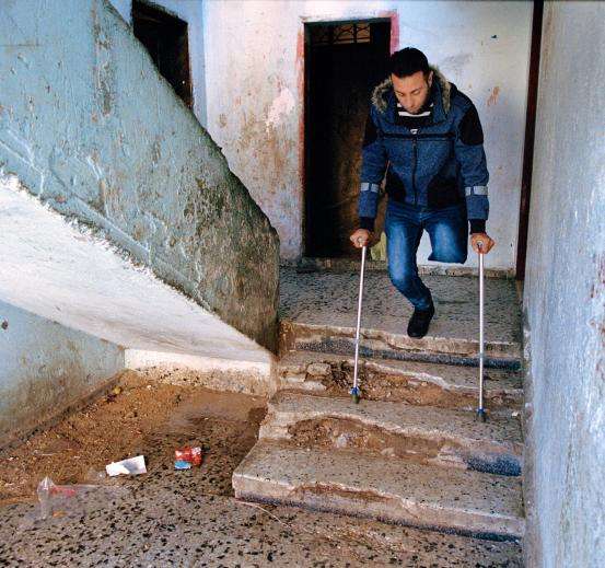 A disabled Palestinian man who was amputated after the Great March of Return in Gaza uses crutches.