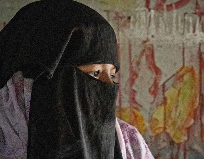 Profile of a Rohingya woman in a niqab in a camp in Cox's Bazar, Bangladesh