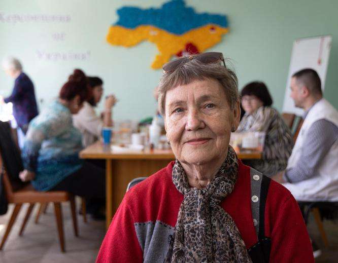 A mental health patient smiles in a support center for displaced persons in Ukraine. 