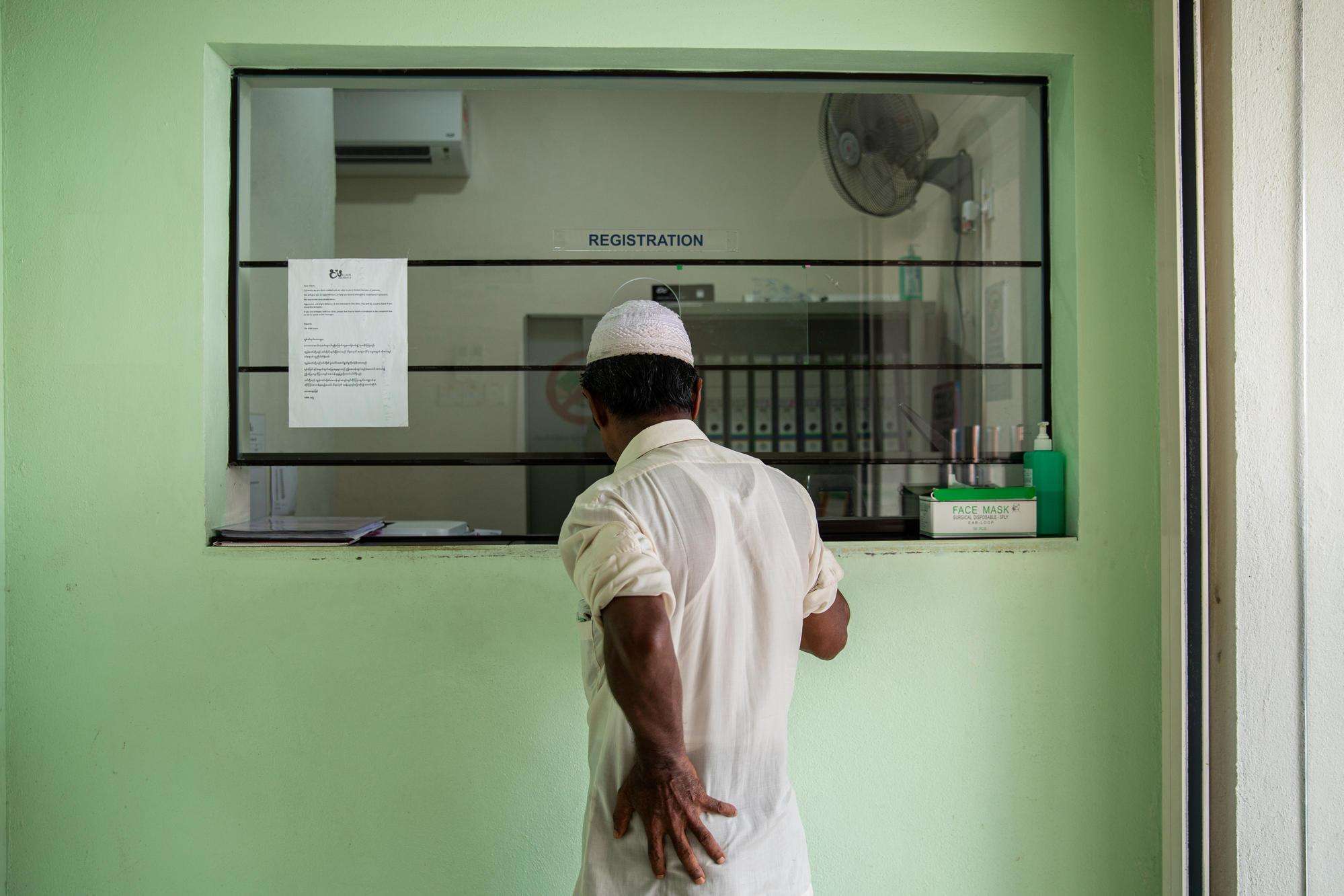 A relative of a Rohingya man who fell two floors while working at a construction site, reports to the registration office at MSF’s clinic in Penang to check on his health. Malaysia, April 2019.