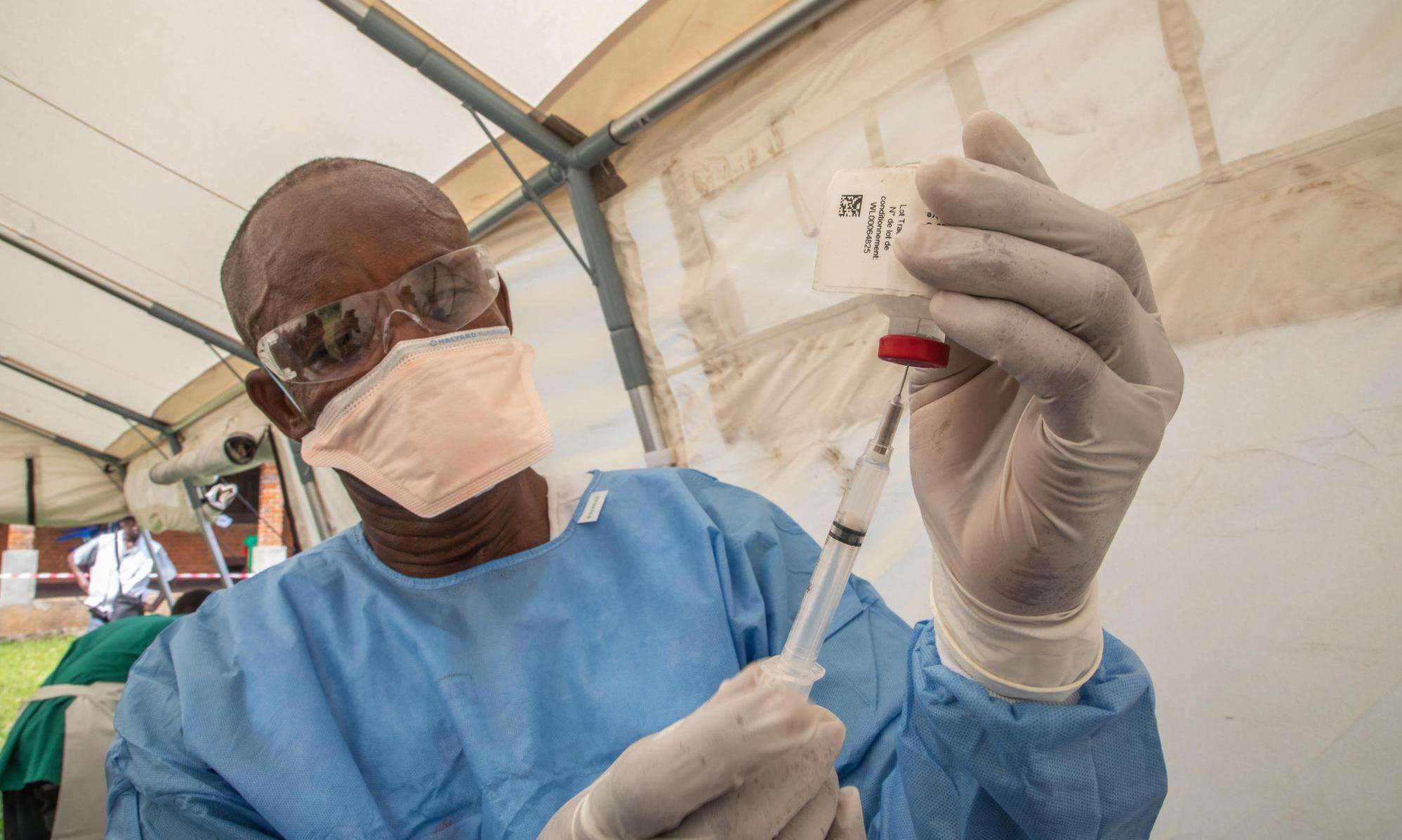 A nurse prepares an Ebola vaccine in Bikoro during the 2018-2020 Ebola epidemic in the Democratic Republic of Congo.