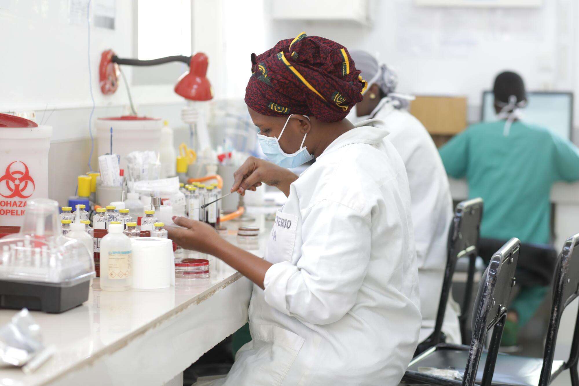 A technician works on a culture in the the CSref bacteriology laboratory in Koutiala, Mali.