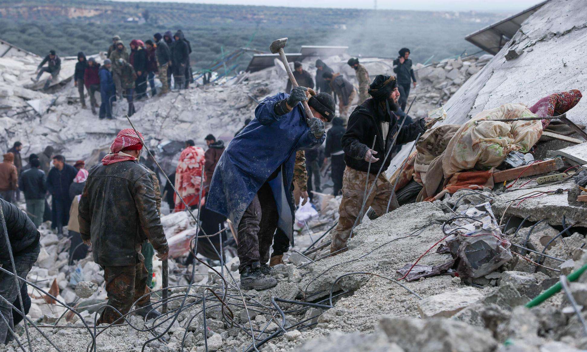 Syrians dig through the rubble left by the earthquake in northwest Syria in 2023.