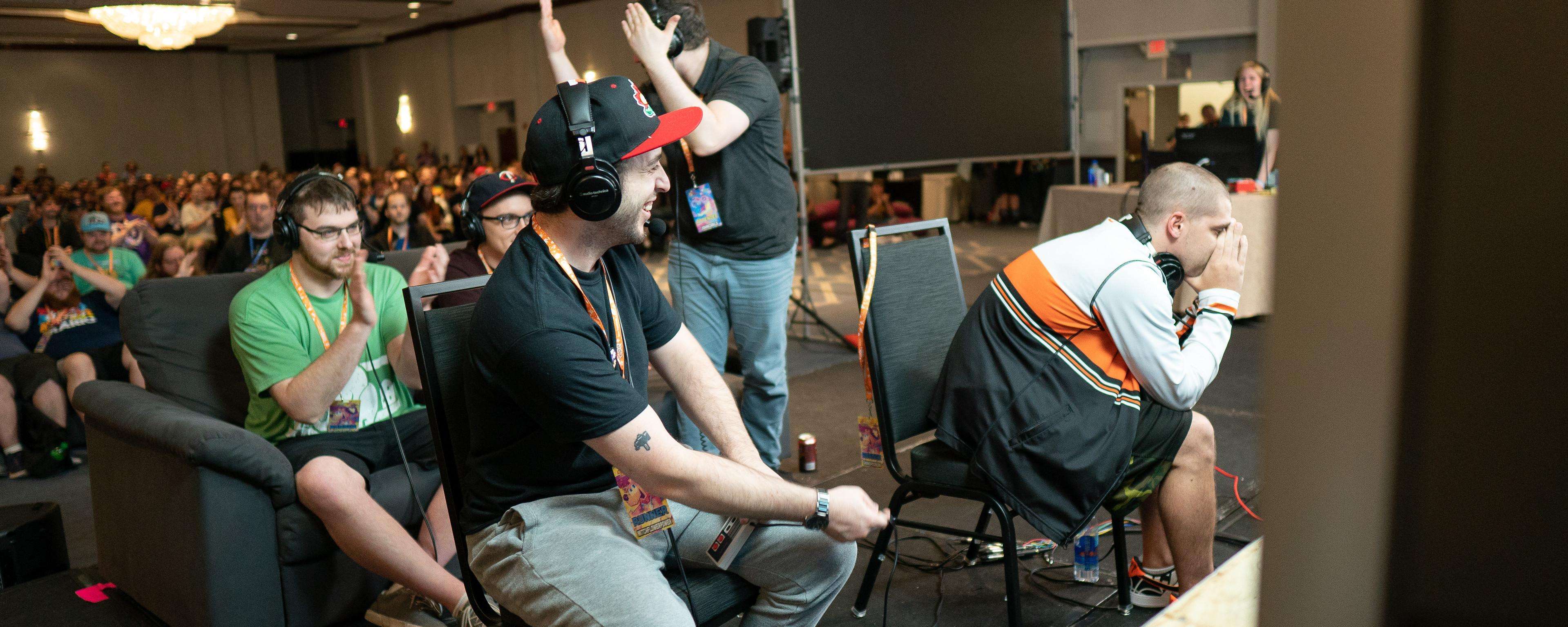 A gamer relishes victory and another regrets defeat, at Summer Games Done Quick 2018.