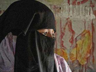 Profile of a Rohingya woman in a niqab in a camp in Cox's Bazar, Bangladesh