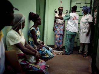A group of people wait to receive care at an MSF HIV care clinic.