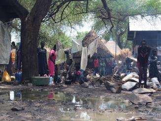 South Sudanese Refugees at the Pagak Reception Centre gathering around a fire