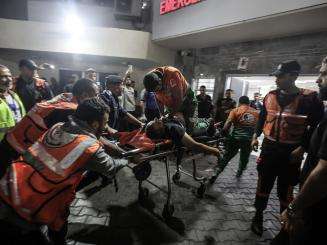 A Palestinian civil defense officer is resuscitated at Al Shifa Hospital in Gaza on October 16