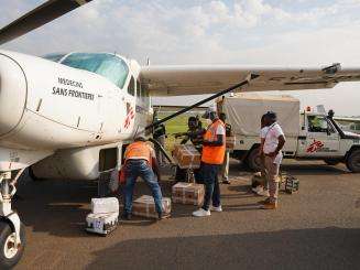 MSF staff load boxes containing hepatitis E vaccines into an MSF plane at Juba International Airport. 