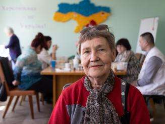 A mental health patient smiles in a support center for displaced persons in Ukraine. 