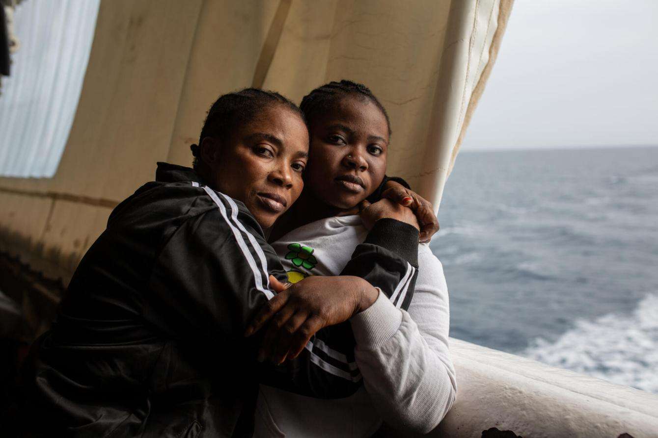 A mother and daughter embrace aboard MSF's migrant search and rescue ship Geo Barents in the Mediterranean.