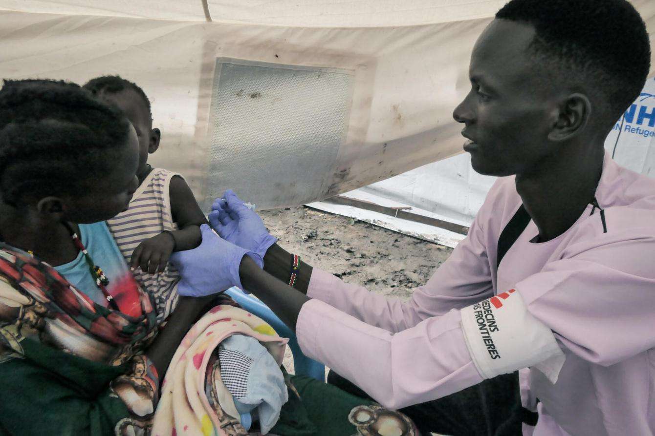 MSF Nurse Gatwech Tuoch vaccinates a child against measles at an MSF mobile clinic in South Sudan.