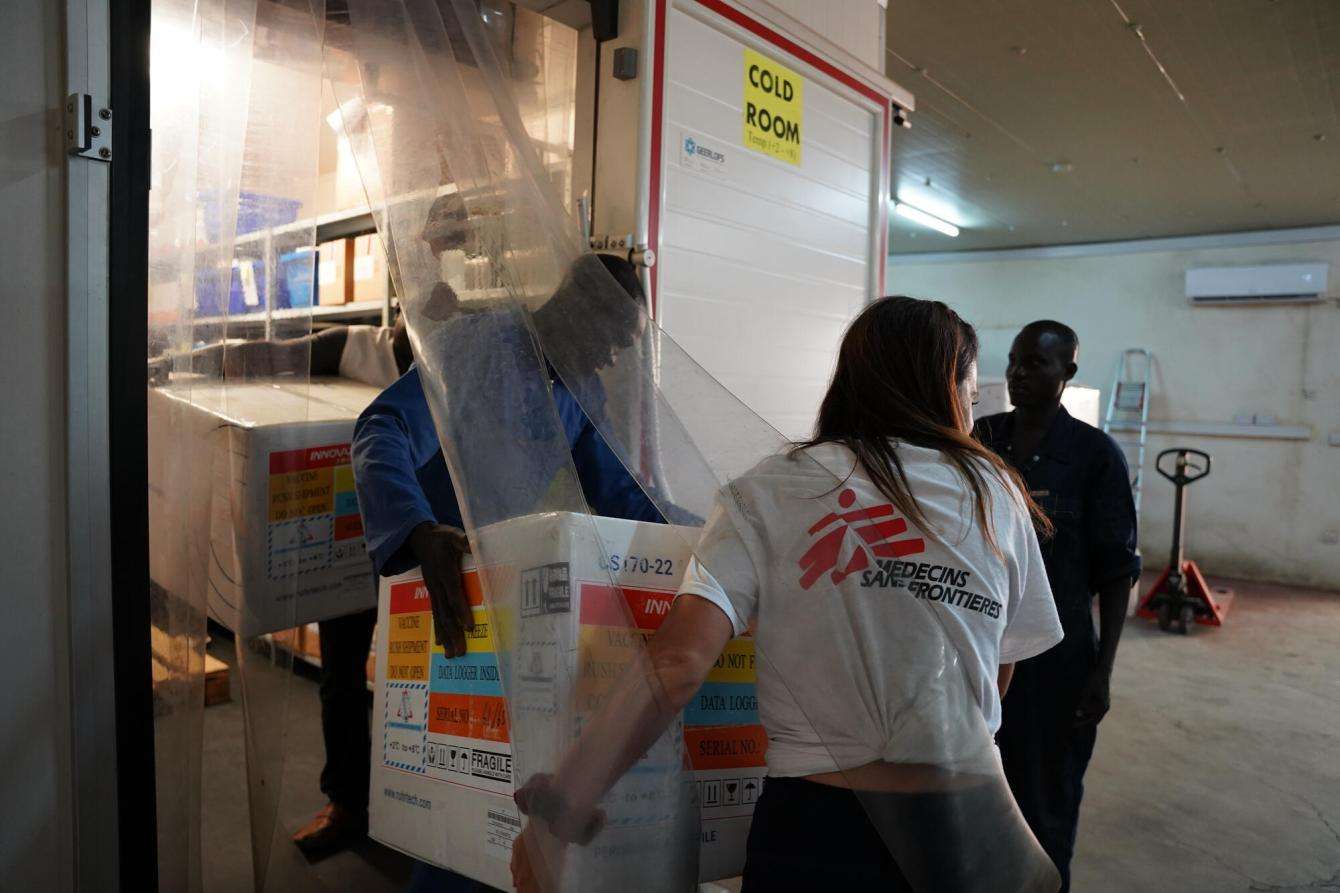 MSF staff carry Hepatitis E vaccines in the MSF cold room in Juba, South Sudan.