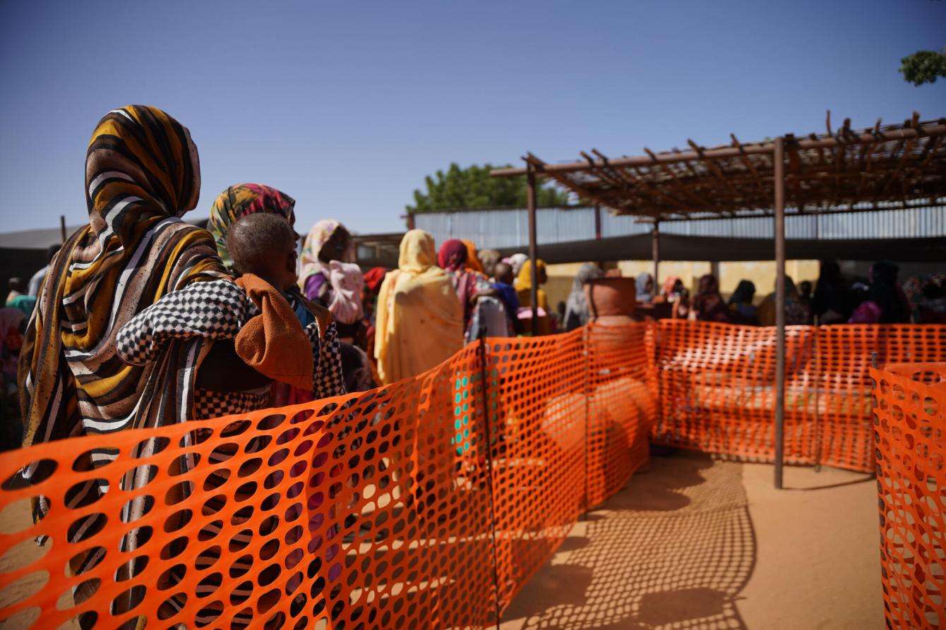 Displaced people line up outside MSF's clinic in Zamzam camp near El Fasher, Sudan.
