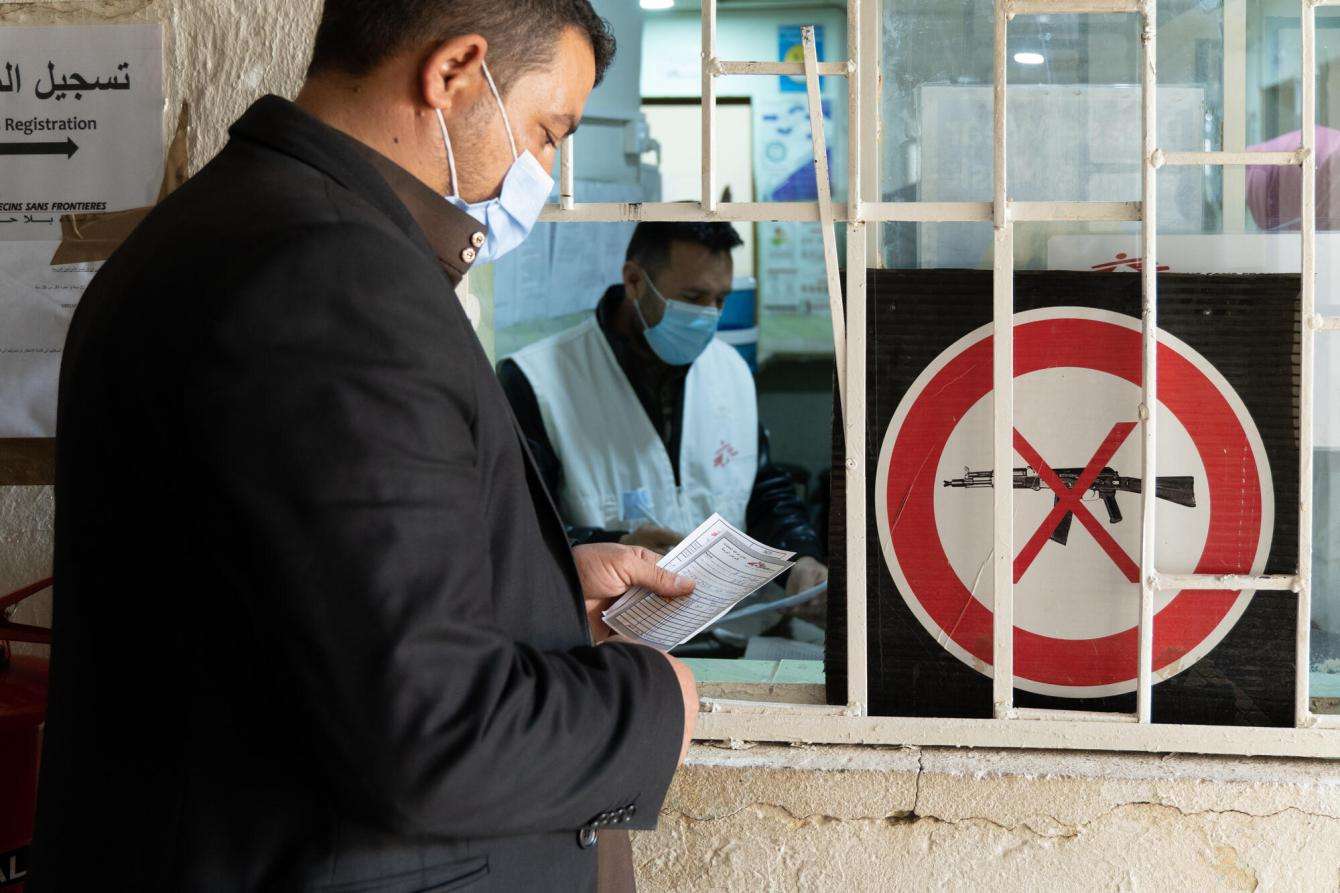 A patient checks in at the registration unit of the MSF-run clinic for chronic diseases inside the Hawija primary health care center in Iraq.