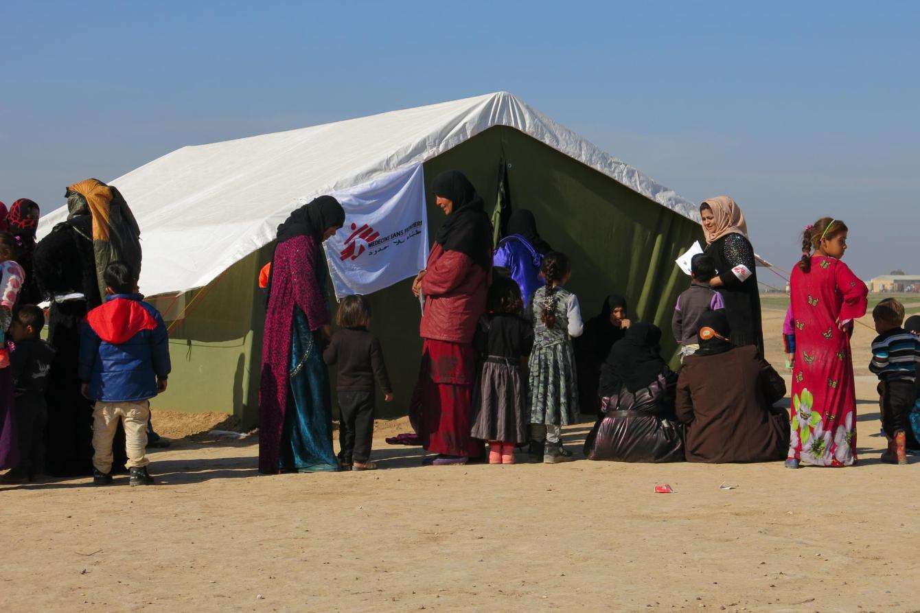 Patients wait outside MSF's mobile clinic in Tuz Kurmato, Kirkuk, Iraq.