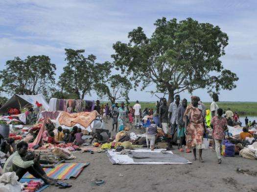 People fleeing Sudan arrive at Bulukat port in Malakal, Upper Nile State in South Sudan.