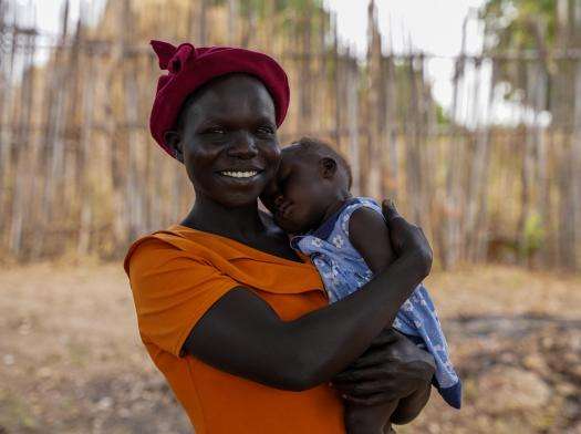 A woman holds her baby in Kajo Keji, South Sudan.