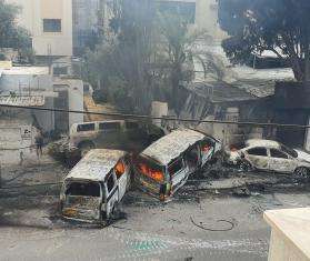 Destroyed vehicles in MSF convoy attack in Gaza