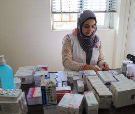 A member of MSF's medical mobile team in Nabatiyeh, south of Lebanon sorts through medicine stock.