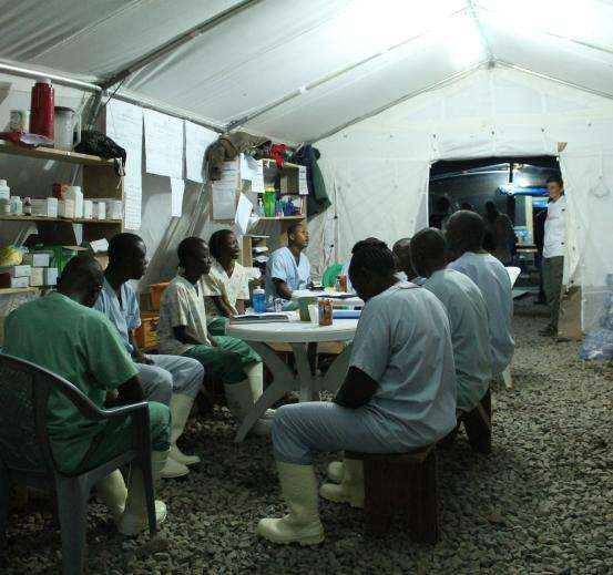 Liberian staff in Foya pray together, giving thanks that they are still healthy. 