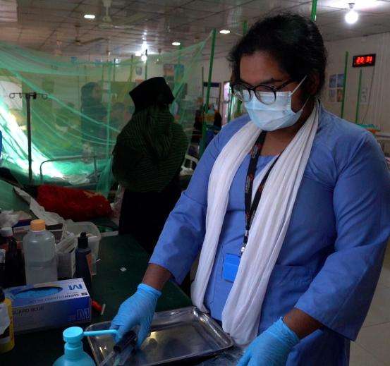 ICU Nurse Noami Biswas at work in MSF Goyalmara Hospital paediatric intensive care unit